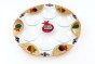 Rosh Hashanah Seder Plate with Colorful Pomegranates in Glass